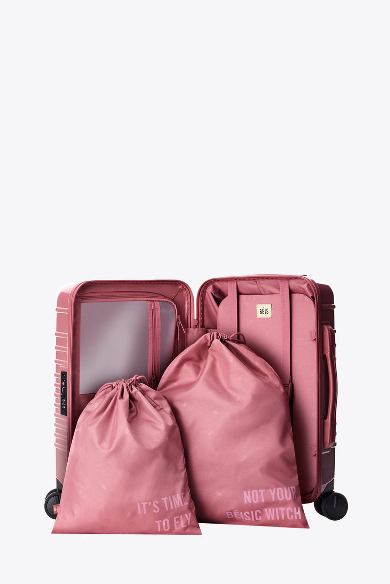 The Small Carry-On Roller in Wicked Pink